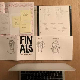 Stack of work bits, Marina Hor-Meyll Lemos's 'zine, and the ever-faithful mac.