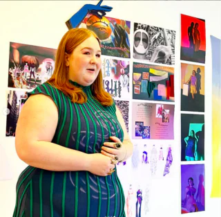 Student Antonia Grabher Avery presenting her knitted garment for the end-of-semester critiques.